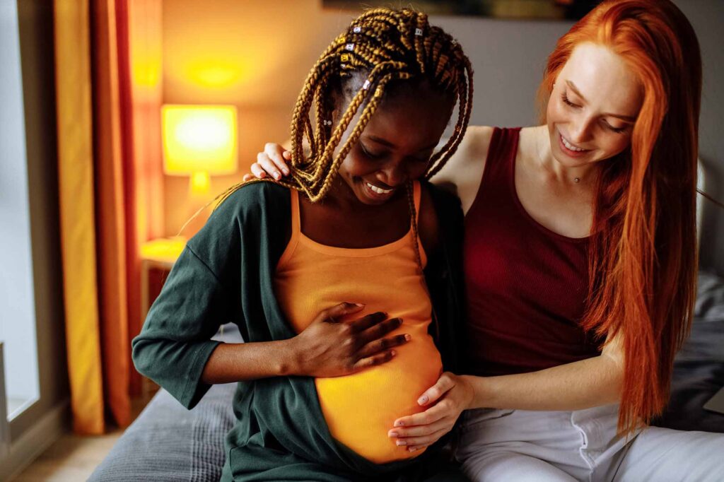 mixed race couple awaiting a baby