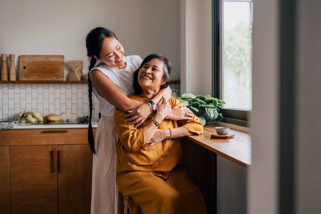 Daughter embracing her mother