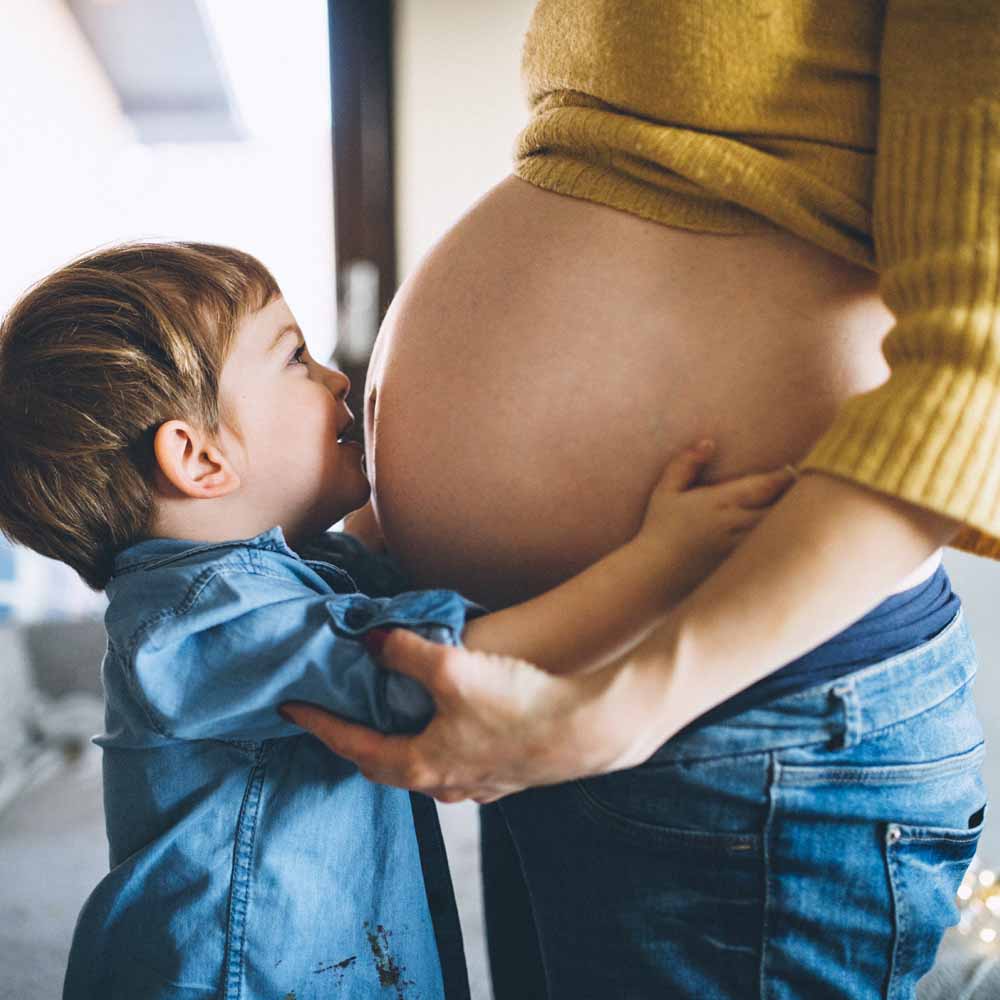 Pregnant woman and boy